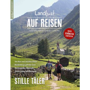 Cover des Magazins "Landlust AUF REISEN". Zwei Wanderer auf einem Pfad in einer alpinen Landschaft mit Kirche. Text: Beschreibung von Reisezielen, darunter Mecklenburger Seen und Alpentäler. Themen: Entdecken und Erleben.