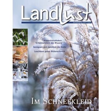 Cover des Magazins "Landlust" Ausgabe Januar/Februar 2022. Zeigt schneebedeckte Grashalme. Themen: Klosterbibliotheken, Kiefern, gelber Blumenschmuck. Mit Bildern von Schneeglöckchen, Gebäck und einem Schneemann.