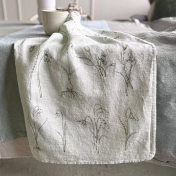Hellgraues Geschirrtuch mit feinen floralen Linienmustern, weiche Baumwollstruktur, dezente Frühlingsfarben, natürliche Optik.