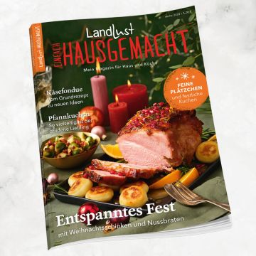 Cover des Magazins "Landlust Einfach Hausgemacht" Ausgabe sechs 2024. Es zeigt einen Weihnachtstisch mit Schinken, Braten, Kerzen und herbstlicher Dekoration. Enthält Themen zu Käsefondue, Pfannkuchen und festlichen Kuchen.