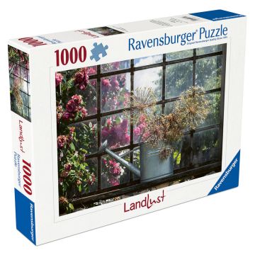 Puzzlekarton mit Bild eines Gartens: verrostetes Fenster, Gießkanne, blühende Rosen und trockene Pflanzen. Ravensburger-Logo und Schriftzug „Landlust“. 1000 Teile.