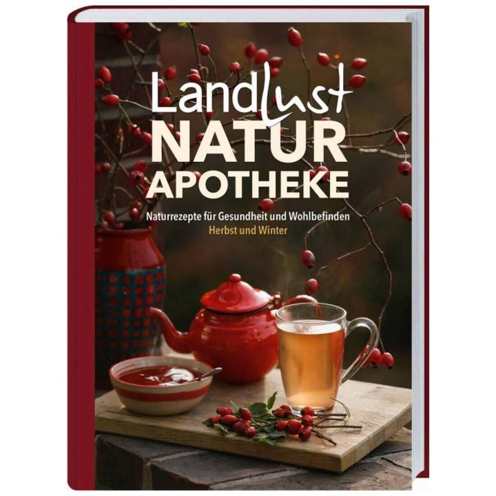 Buchcover der "Landlust Naturapotheke" zeigt eine rote Teekanne, eine Tasse Tee, Hagebuttenzweige und den Untertitel "Naturrezepte f&uuml;r Gesundheit und Wohlbefinden, Herbst und Winter" vor herbstlichem Hintergrund.