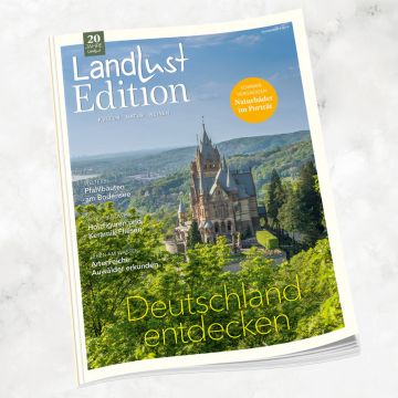 Zeitschrift „Landlust Edition“ mit Titelbild von Schloss Drachenburg im Siebengebirge, umgeben von Wald; Titeltext: „Deutschland entdecken“; weitere Themen zu Natur, Kultur und Reisen in Deutschland sind links aufgelistet.